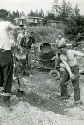 Men digging the foundation for a house