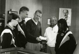 B.C. Government cheque presentation to Percy Perry and daughter from John Cashore, MLA