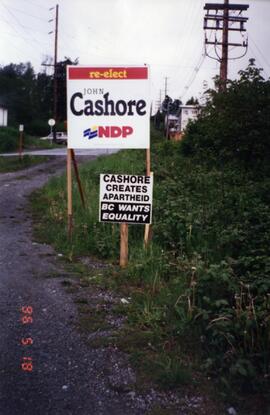 Re-elect John Cashore sign with opposition sign