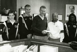 B.C. Government cheque presentation to Percy Perry and daughter from John Cashore, MLA