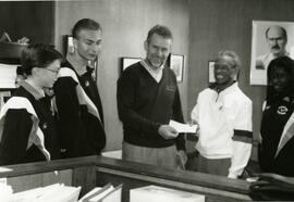 B.C. Government cheque presentation to Percy Perry and daughter from John Cashore, MLA