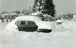 Car buried under snow