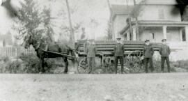 Firefighters with horse drawn wagon