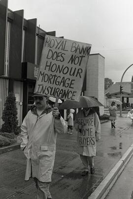 Protesters in front of bank during the May Day parade in PoCo