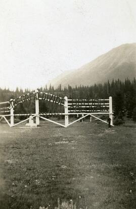 Man standing next to sign marking the Great Divide between British Columbia and Alberta