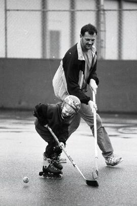 Father and son at Lacrosse rink beside George Pearkes school