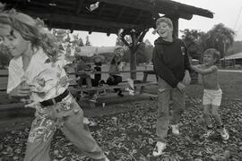 Kids play in leaves at Rocky Point Park