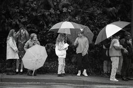 Glen Elementary School students in the rain beside Coquitlam Centre