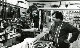 Two men in a hunting store
