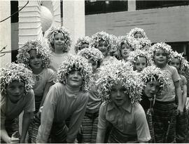 Kids in tinsel wigs
