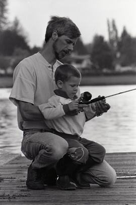 Father and son fishing at Como Lake in Coquitlam