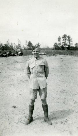 Man in uniform standing on a beach