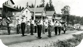 Maillardville marching band in front of Tremblay Social Hall