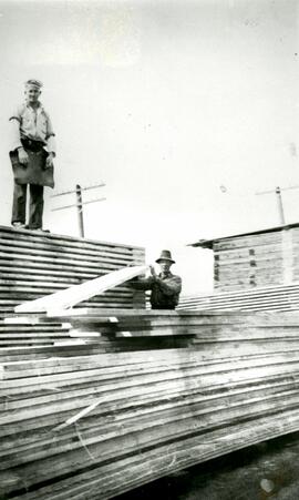 Lumber piler with Hjalmar Ronnlund on the left