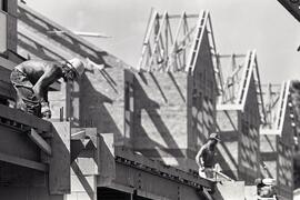 Construction workers working on one of many new housing developments being built along Prairie Av...