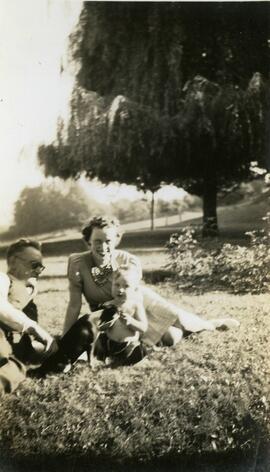 William Headridge, Billie Headridge and a baby sitting on a lawn