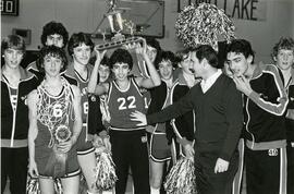 High school basketball team with trophy