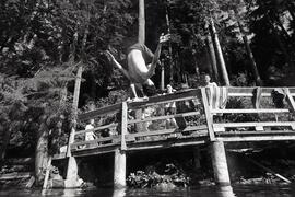 Guys jumping off small bridge at Sasamat Lake