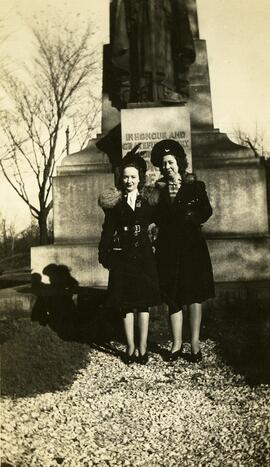 Two women standing in front of a War Memorial in Saint John, New Brunswick