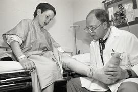 Doctor treats a banged knee at the emergency ward at Eagle Ridge Hospital in Port Moody