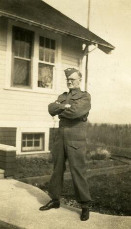 William Headridge standing in a yard in uniform