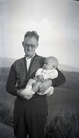 William Headridge holding a baby