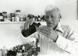 Man pouring medicine from a bottle