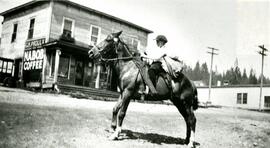 Albert Pett on horseback outside of Proulx Store