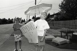 Girls at lemonade stand on Stewart Ave. in Coquitlam