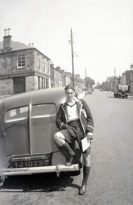 Blythe Ritchie leaning against a car
