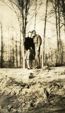 Eleanor and John Headridge in uniform standing in a forest