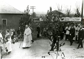 Religious procession through Maillardville led by Father Delestre