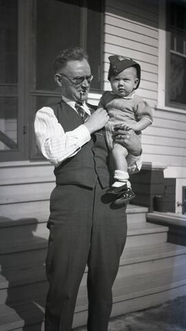 William Headridge holding a baby