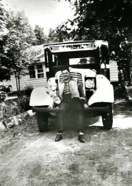 Mac Gilroy sitting on a truck