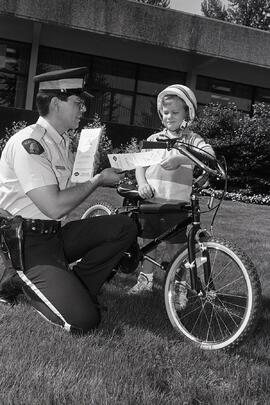 Constable writes ticket during bike safety week