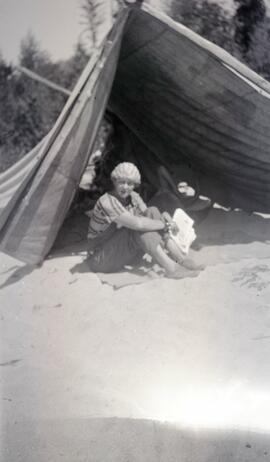 Woman in a tent on a beach