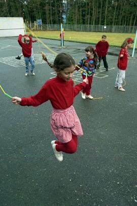 Kids dressed in red skipping rope for heart fund at College Park Elementary