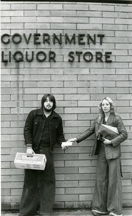 Man and woman outside a government liquor store