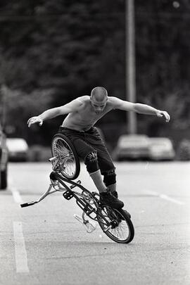 Jamie Mcintosh doing freestyle BMX in Coquitlam Rec Centre parking lot