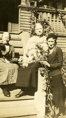 Two older women seated with Sadie (Healey) Anderson