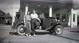 Man and Gordon Headridge standing in front of a car