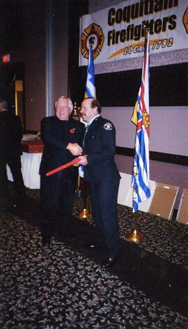 Tim Kernighan receiving an award