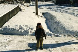 Child in the snow at 1205 Hammond Avenue