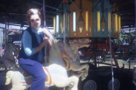 Nina Seller on a carousel
