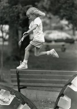 7 year old Angela Barnett of Ontario leaps between two tires at Sapperton Park in New Westminster on Saturday afternoon