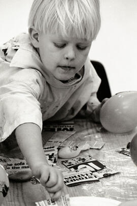 Various sundry cute kids getting messy with paper mache at Mashed Potatoes program at Town Centre