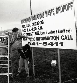 Ruby Willis and Dick Koufalis are putting up the hazardous waste signs in PoCo for this weekends dropoff program