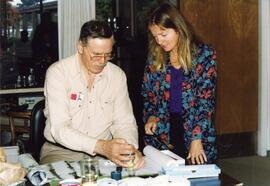 Roxanne Chappell, instructor, and Humphrey Hamilton discuss technique in Chinese Brush Painting classes.