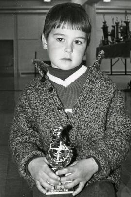 Kid with hockey trophy