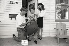 Metro Valley - Dave Jennings. Promo. News paper carrier on front porch of block parent getting first aid